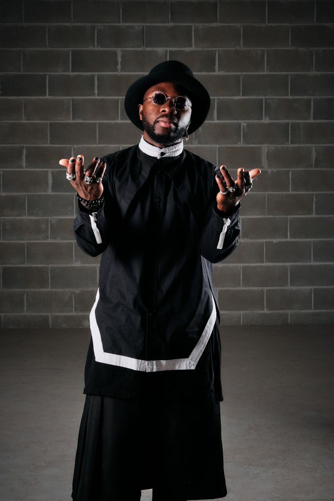 Man wearing Black outfit looking at camera
