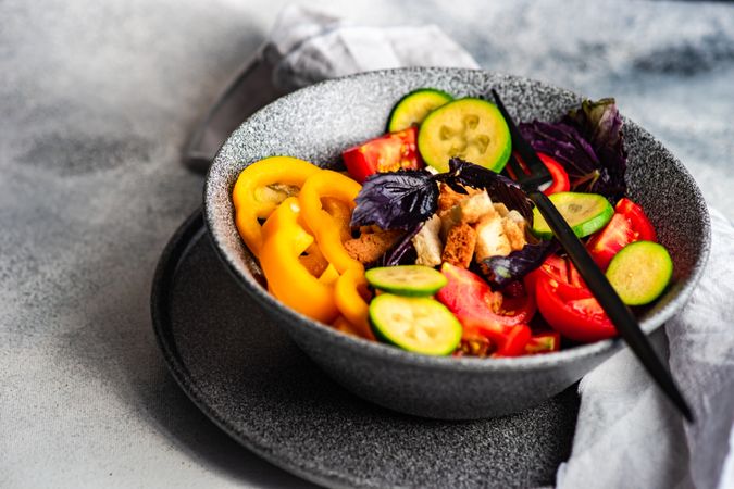 Healthy gourmet salad with tomatoes, cucumber and yellow peppers