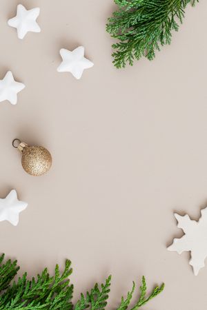 Top view of Christmas ornaments on pink background