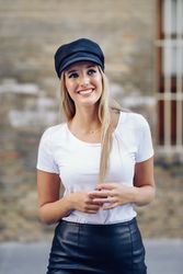 Smiling trendy woman walking outside