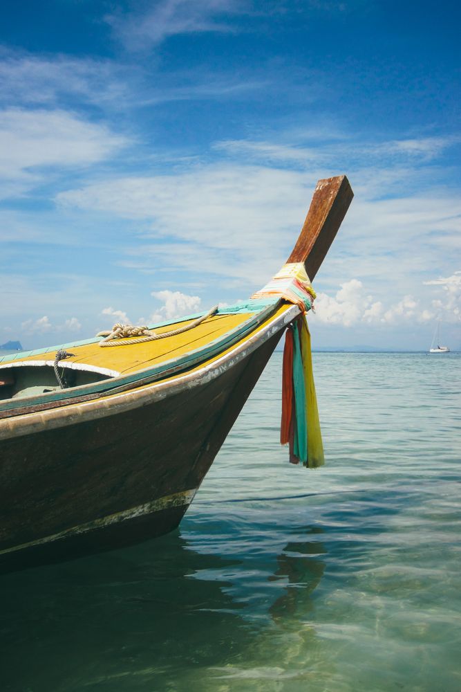 Floating boat in peaceful clear water