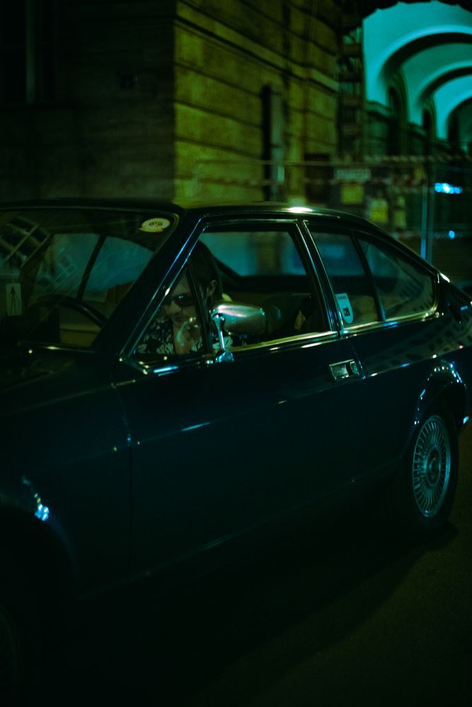Dark retro car parked at night