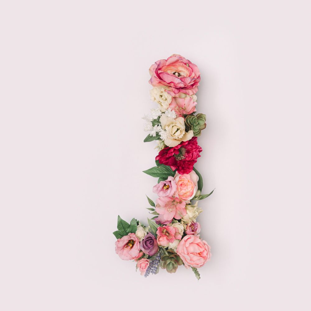 Letter J made of real natural flowers and leaves