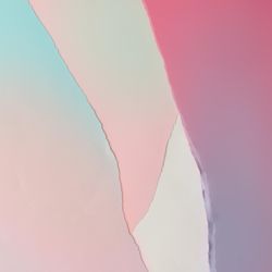 Pieces of ripped pastel colored paper in pattern