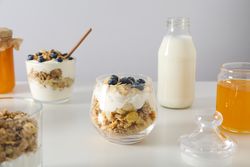 Tasty and nutritious breakfast concept - muesli with yogurt