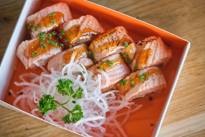 Seared salmon sushi rolls in box