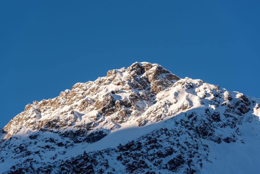 Mountain peak in the Bavarian Alps covered in snow on a sunny day in December