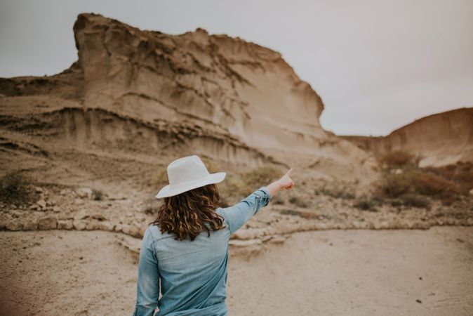 Female tourist walking on sandy quarry