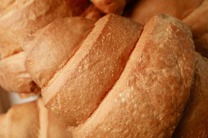 Fresh baked croissants texture background, close up
