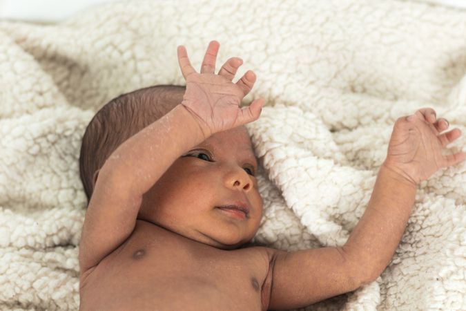 Newborn baby on soft blanket
