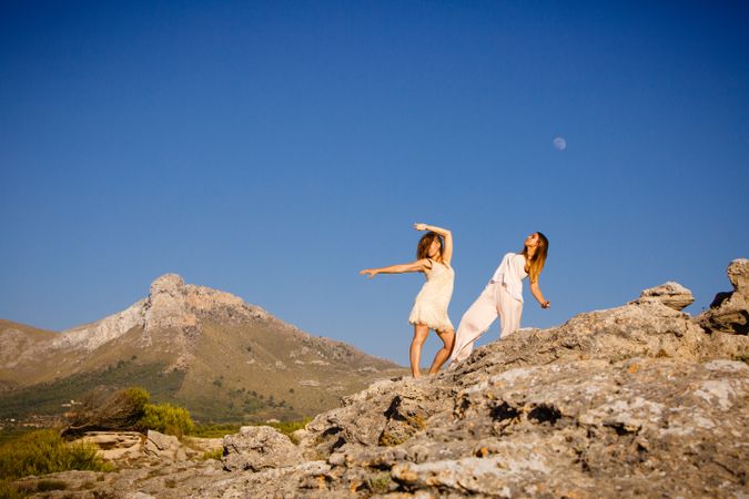 Young women posing on stones