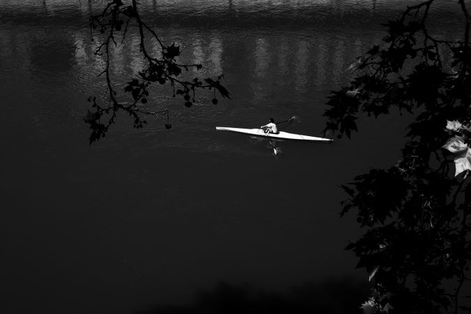 Male rowing in river
