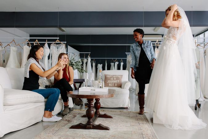 Bridal party shopping for wedding dress