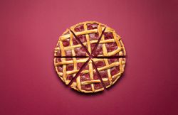 Sliced raspberry pie with a lattice crust. Tasty classic dessert