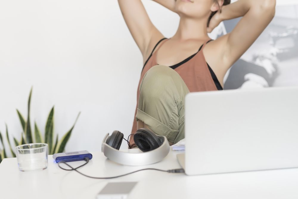 Top of office desk with woman in background