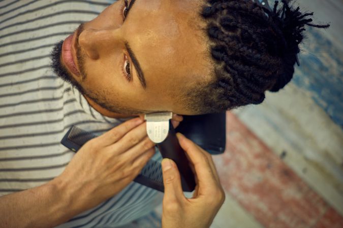Anonymous hairstylist doing a haircut