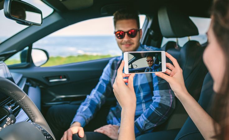 Woman taking picture with mobile to her boyfriend