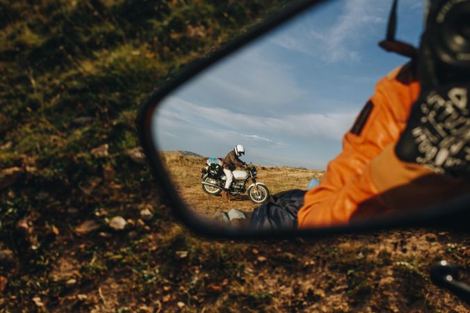 Motorcyclist in rear view mirror