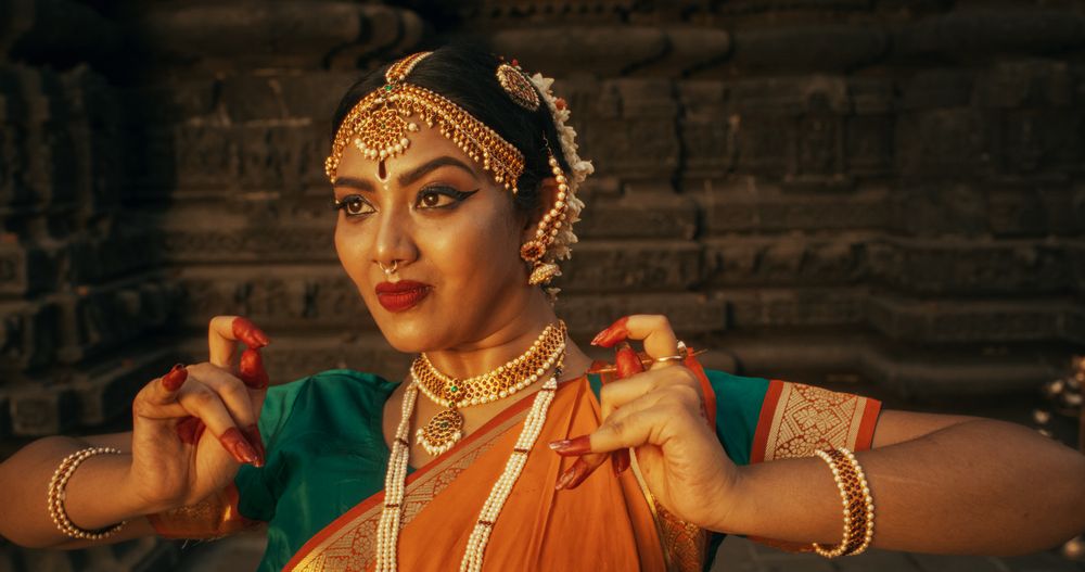 Energetic Indian Woman Showcases the Graceful Movement of Her Legs in Traditional Attire while Dancing Bharatanatyam.