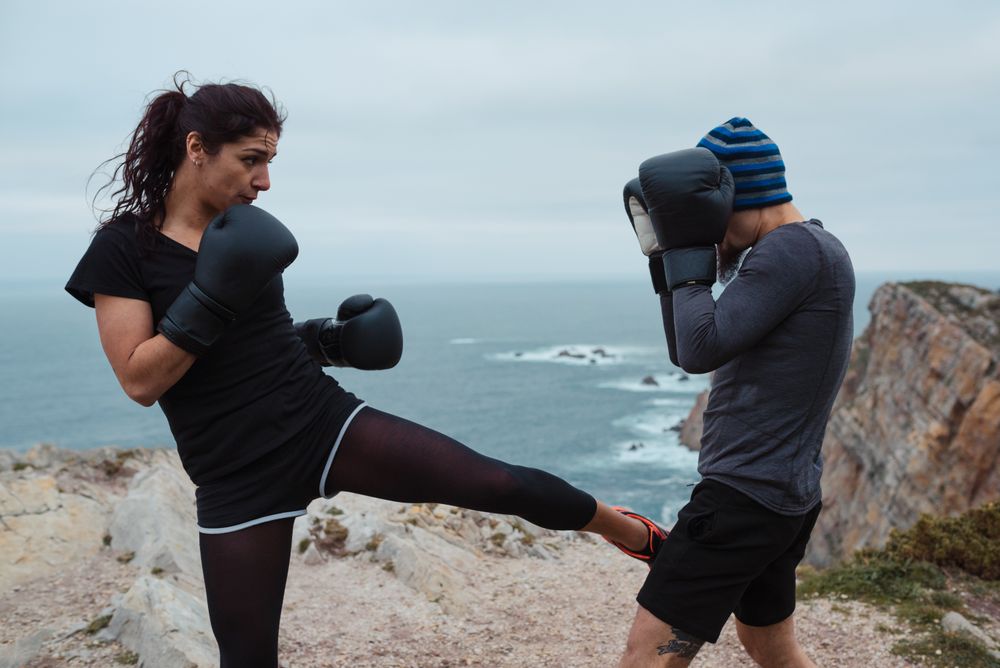 Boxers exercising on cliff