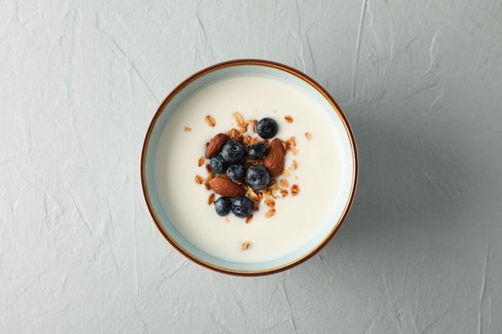 Bowl with parfaits dessert on cement background