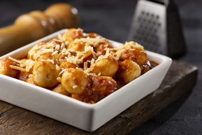 Gnocchi with tomato sauce and grated Parmesan cheese.