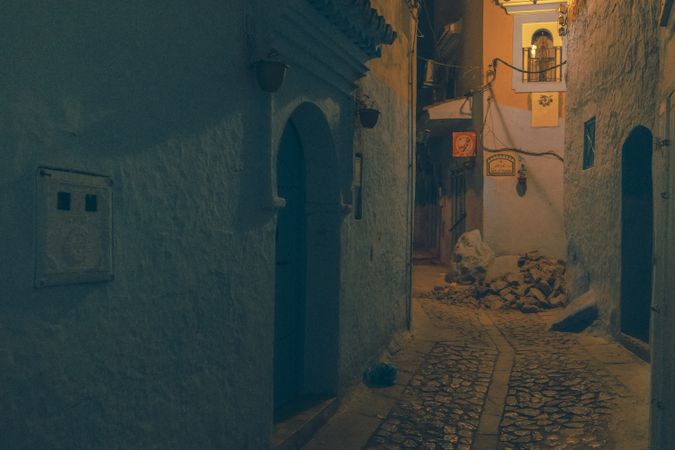 Old narrow street of town at night