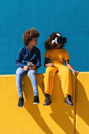 Black teenagers using modern gadgets