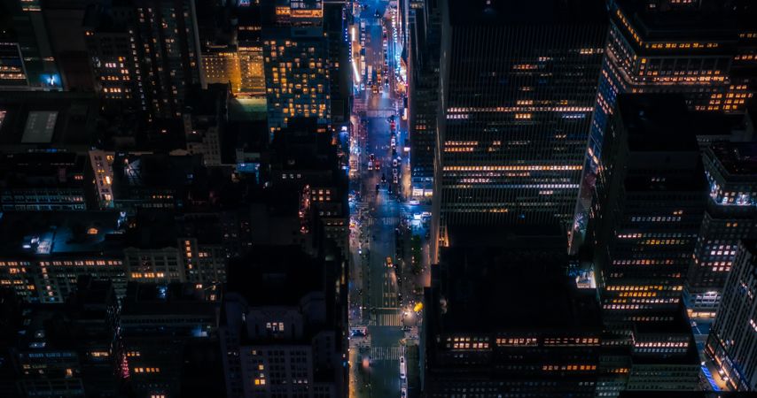 Helicopter Night Tour of New York City Architecture. Glowing Times Square with Groups of Tourists Enjoying Manhattan Nightlife and Admiring the Landmark with Diverse Advertising Billboards