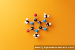 Molecular structure over orange background 5QQRN5
