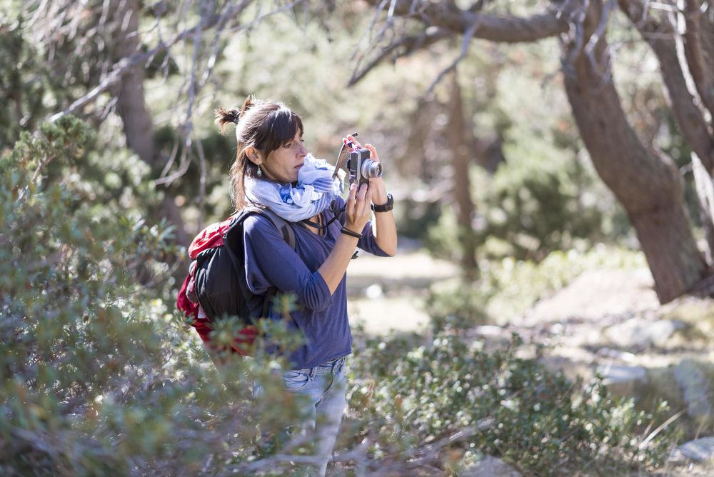 Woman taking photo in nature
