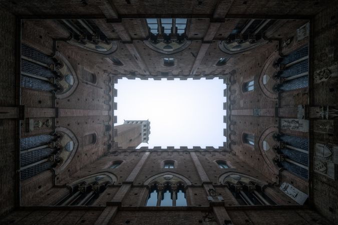 Perspective view from courtyard on stone tower