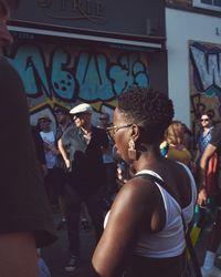 London, England, United Kingdom - August 25th, 2019: Woman in front of street art in London