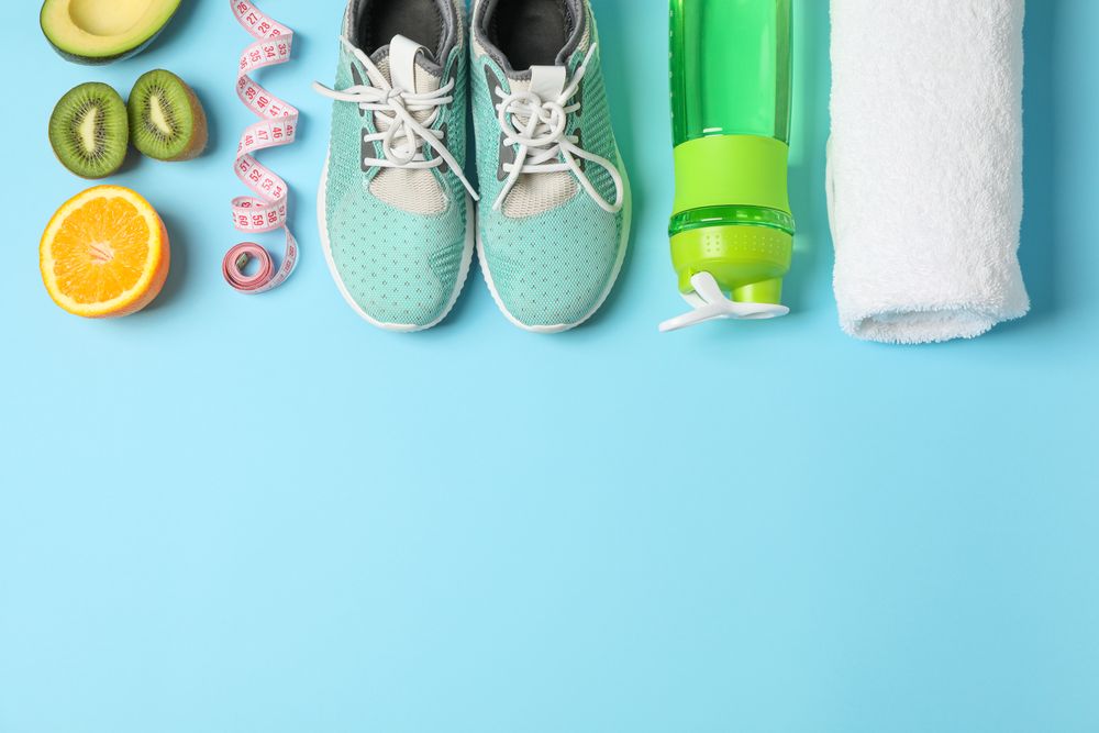 Flat lay composition with loss weigh accessories on color background
