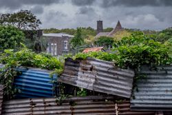 Metal fench looking over lush village
