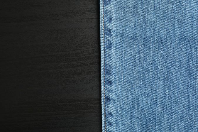 Classic jeans on background, space for text