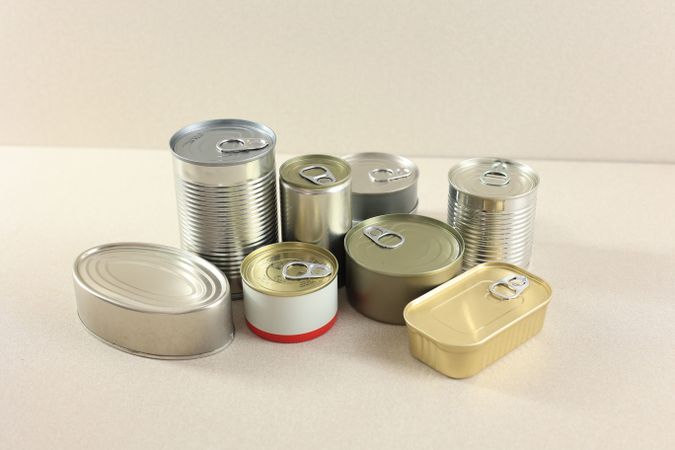 Canned Food Isolated on Cream Background, Food on Tin Jar
