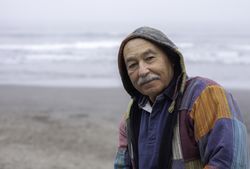 Mature man on empty ocean seashore