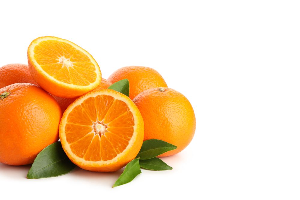 Group of ripe mandarins isolated on light background
