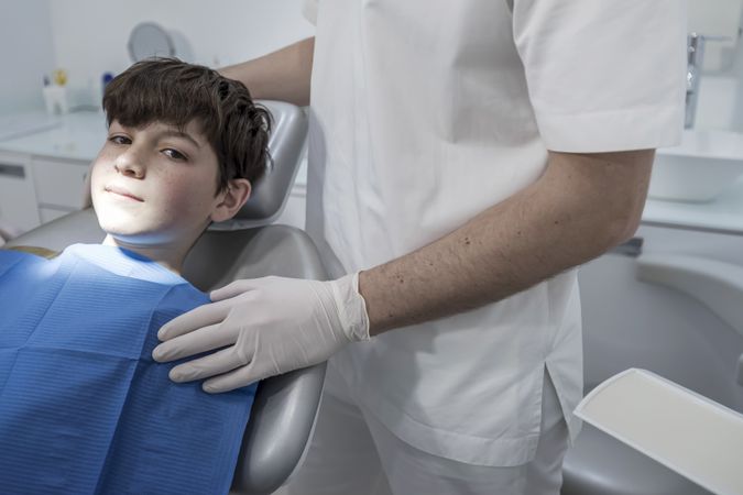 Portrait of teenager boy at the dentist