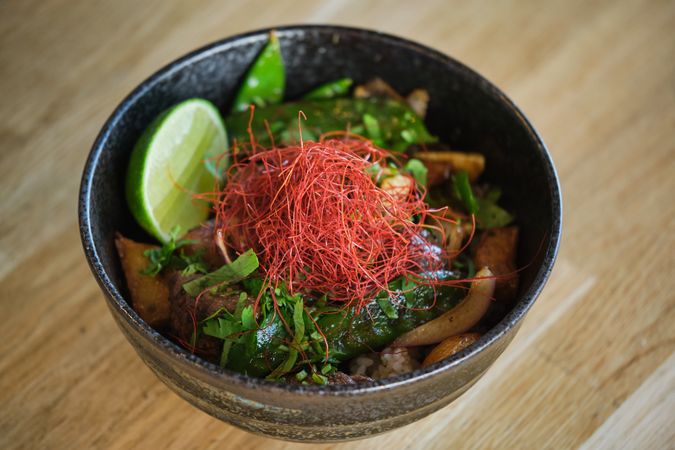 Asian dish with herbs in bowl
