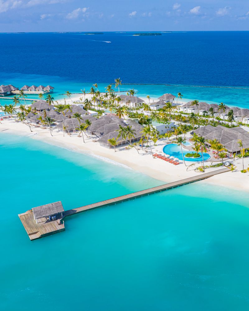 Tropical beach holiday destination with a long pier