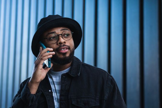 Black man talking smartphone