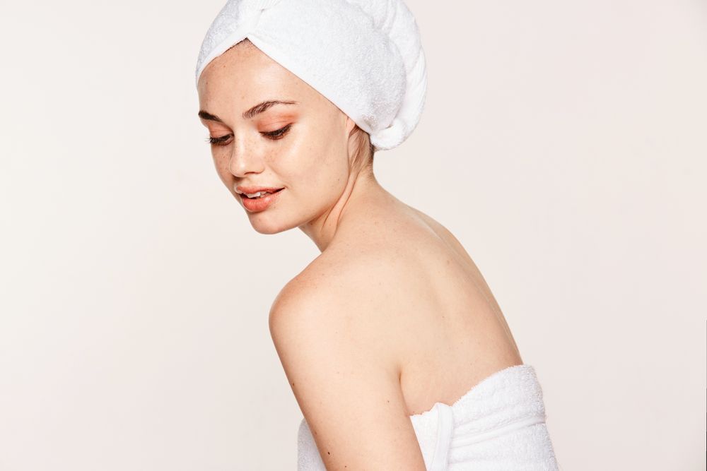 female with radiant body after cosmetic procedure