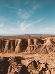 Tourist on sandy canyon hills