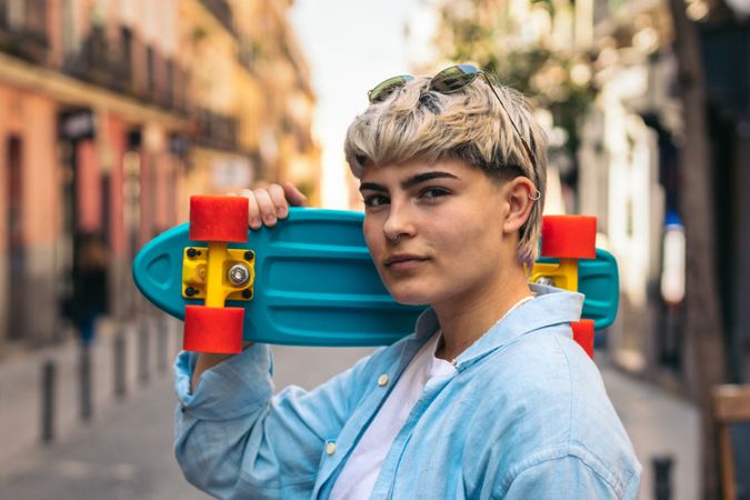 stylish young women with short hair and a skate