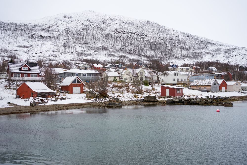Picturesque town in calm lake in winter
