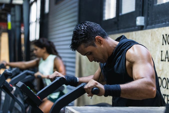 Hispanic sportspeople training in gym