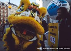London, England, United Kingdom - March 19 2022: Yellow Chinese dragon at anti-racism rally bxnPa5