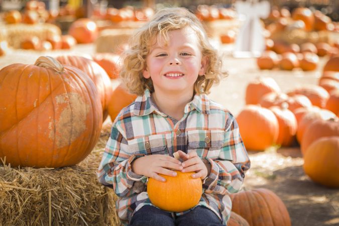 Boy His Pumpkin at Pumpkin Patch.